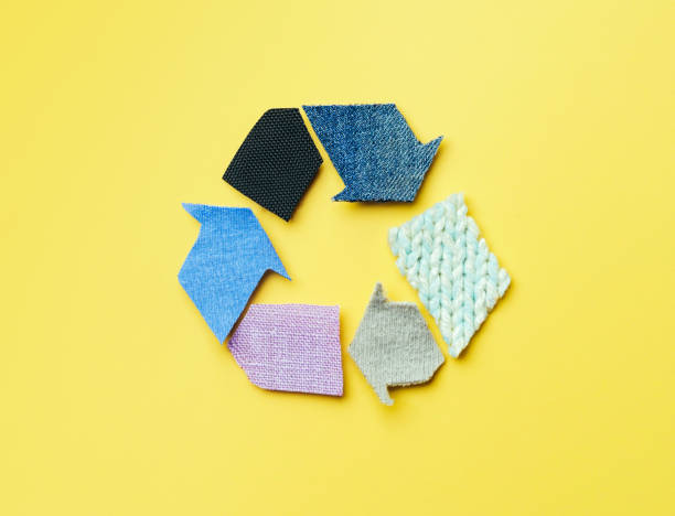 A circular arrangement of fabric swatches showcasing recycled fabrics, representing D&J Fashion's approach to sustainability and the circular economy.
