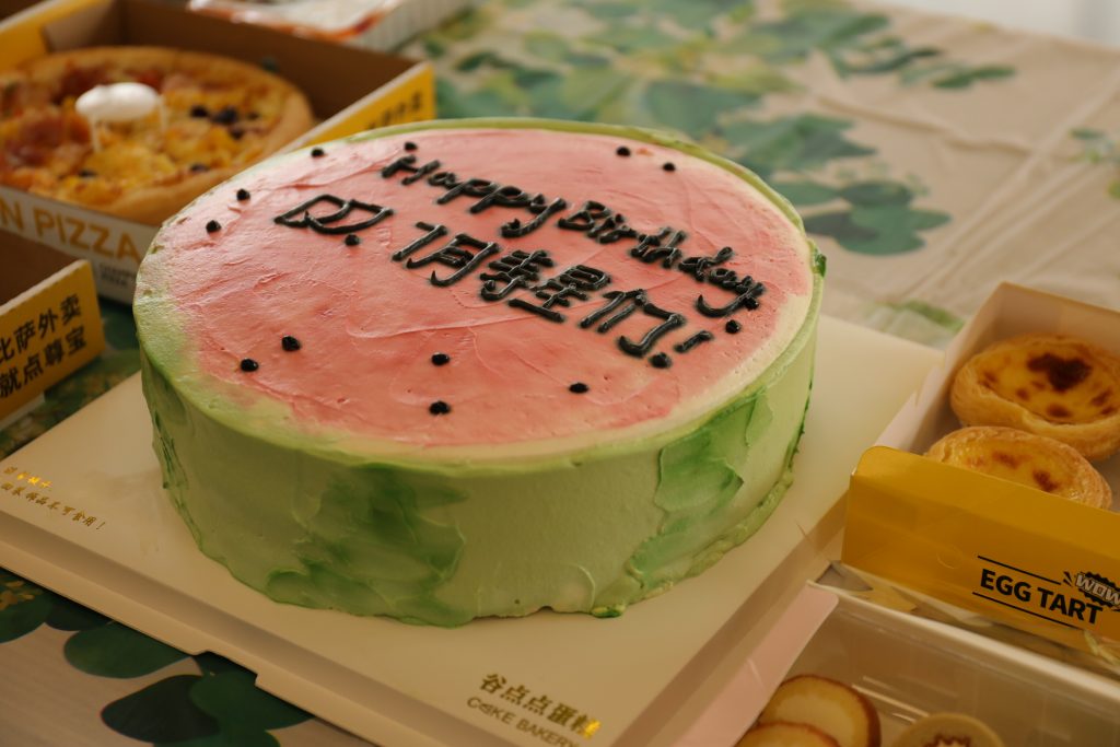 D&J Fashion’s Birthday Cake: A Symbol of Our Team’s Unity A watermelon-themed birthday cake for D&J Fashion’s July birthday celebration, symbolizing fun and celebration.