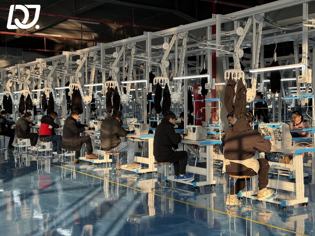 D&J Fashion’s production floor, showcasing workers sewing sustainable fabrics.