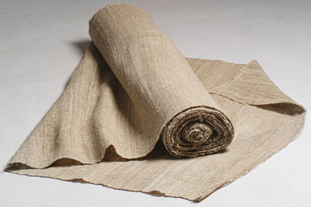 Natural hemp fabric roll used in sustainable women’s fashion design by D&J Fashion.