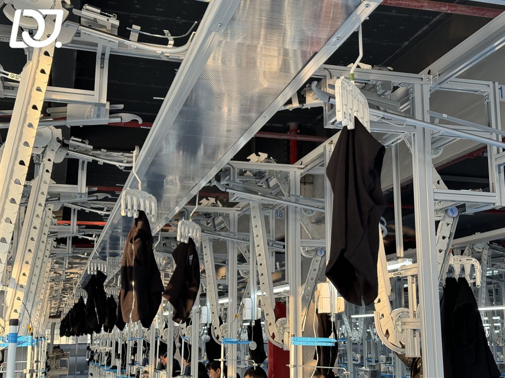 Automated garment production line at D&J Fashion showcasing sustainable fabrics and efficient OEM/ODM processes.